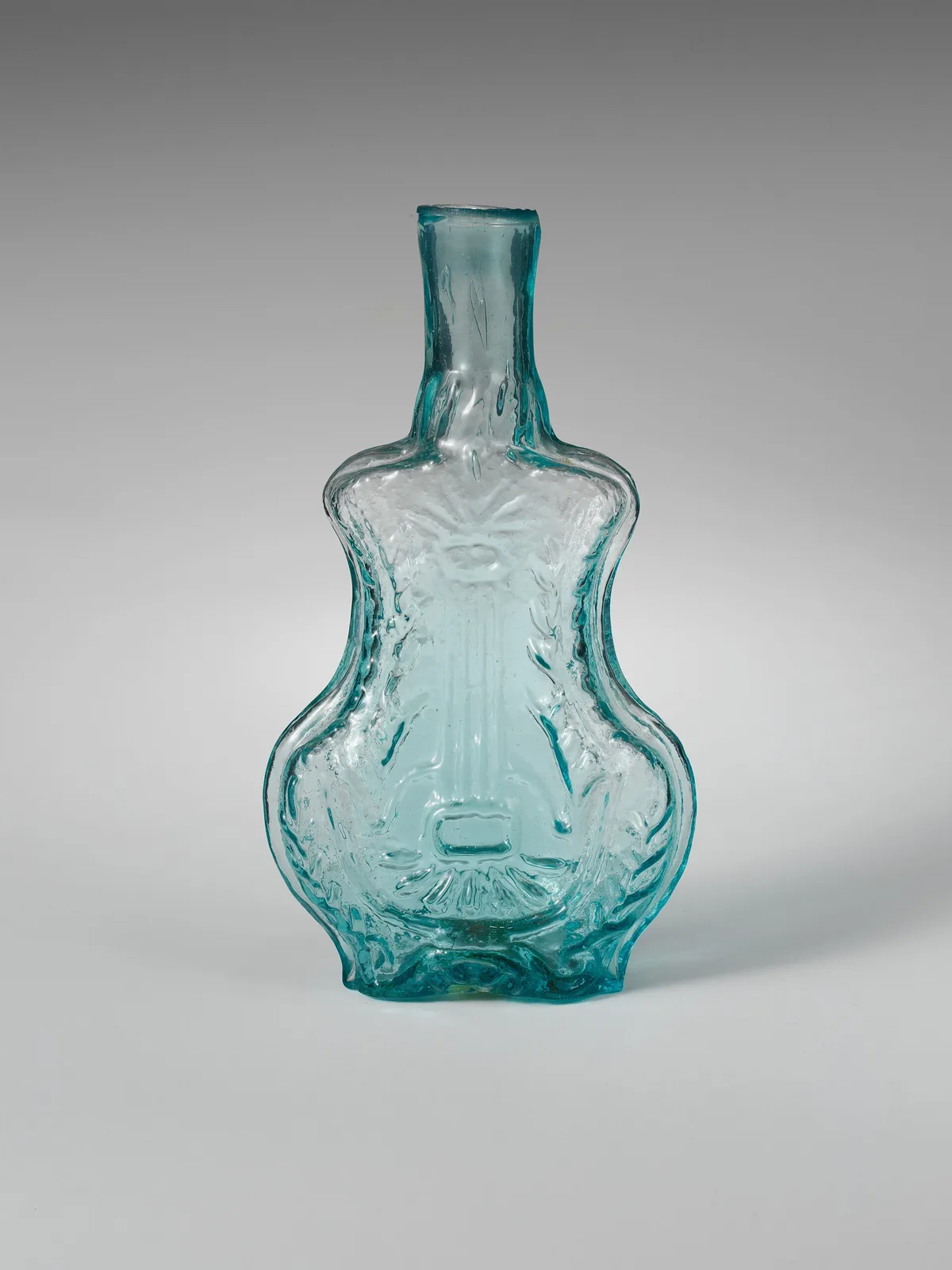 A translucent glass perfume bottle
